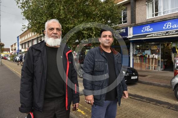 Employee at Herbies Pizza in Farnham Road Abdul Hamid is unhappy about a proposed bus lane along the route planned by the council. He says it will restrict parking for customers and business owners and lead to a loss of trade.Farnham Road, SloughL-R Abdul Hamid from Herbies, Ghulani Mustafa from The Bazaar
