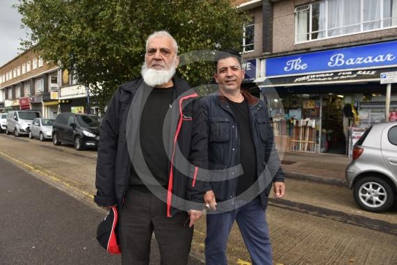 Employee at Herbies Pizza in Farnham Road Abdul Hamid is unhappy about a proposed bus lane along the route planned by the council. He says it will restrict parking for customers and business owners and lead to a loss of trade.Farnham Road, SloughL-R Abdul Hamid from Herbies, Ghulani Mustafa from The Bazaar