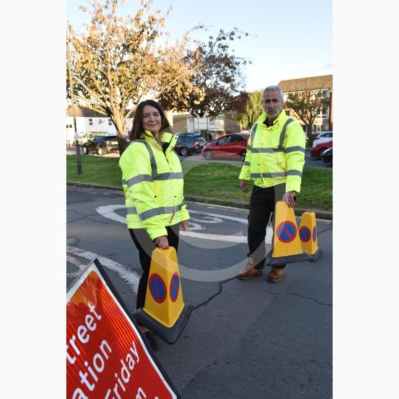 High Street Langley, LangleyHoly Family Catholic School Headteacher Sara Benn and Site Manager Edward Thercaj operating the moveable barriers as part of the School Street scheme. 