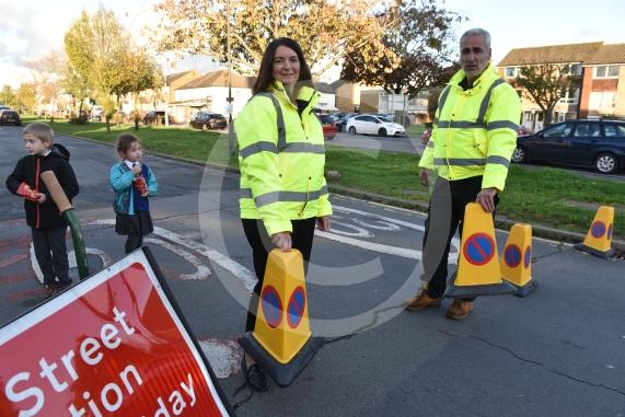 High Street Langley, LangleyHoly Family Catholic School Headteacher Sara Benn and Site Manager Edward Thercaj operating the moveable barriers as part of the School Street scheme. 
