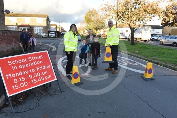 High Street Langley, LangleyHoly Family Catholic School Headteacher Sara Benn and Site Manager Edward Thercaj operating the moveable barriers as part of the School Street scheme. 