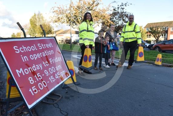 High Street Langley, LangleyHoly Family Catholic School Headteacher Sara Benn and Site Manager Edward Thercaj operating the moveable barriers as part of the School Street scheme. 