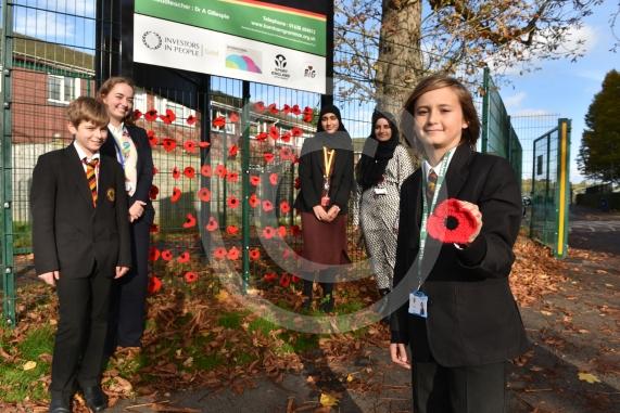 Burnham Grammar School Crochet Club &ndash; poppiesThe school runs a crochet club for students and their current project has been making crocheted poppies for Remembrance Day.L-R John Weeks 11, Eva Baker 16, Aaminah Zia 16,Ms Hafeez, Tobi Dunk 11