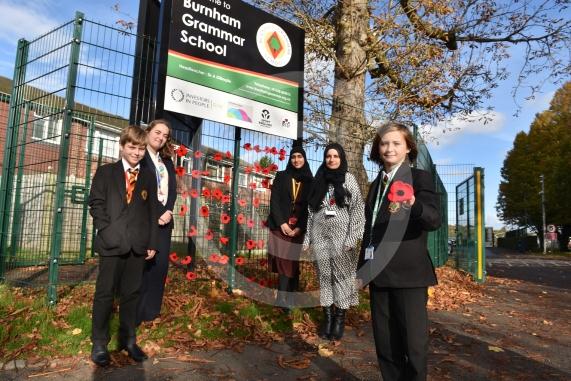 Burnham Grammar School Crochet Club &ndash; poppiesThe school runs a crochet club for students and their current project has been making crocheted poppies for Remembrance Day.L-R John Weeks 11, Eva Baker 16, Aaminah Zia 16,Ms Hafeez, Tobi Dunk 11