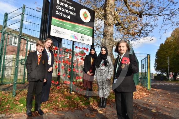 Burnham Grammar School Crochet Club &ndash; poppiesThe school runs a crochet club for students and their current project has been making crocheted poppies for Remembrance Day.L-R John Weeks 11, Eva Baker 16, Aaminah Zia 16,Ms Hafeez, Tobi Dunk 11