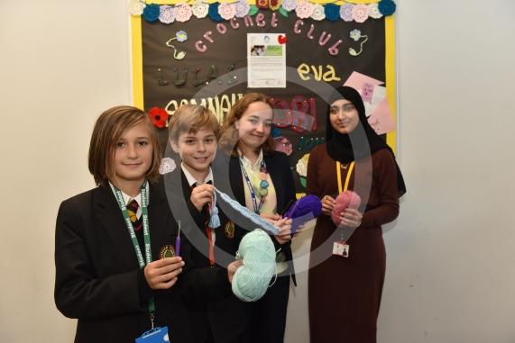 Burnham Grammar School Crochet Club &ndash; poppiesThe school runs a crochet club for students and their current project has been making crocheted poppies for Remembrance Day.L-R Tobi Dunk 11,  John Weeks 11, Eva Baker 16, Aaminah Zia 16
