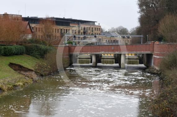 The Environment Agency is dropping 100 tonnes of rocks from a helicopter onto the embankments of the Jubilee River, Maidenhead. The channel has suffered from erosion due to recent storms and the rocks are planned to fix this.