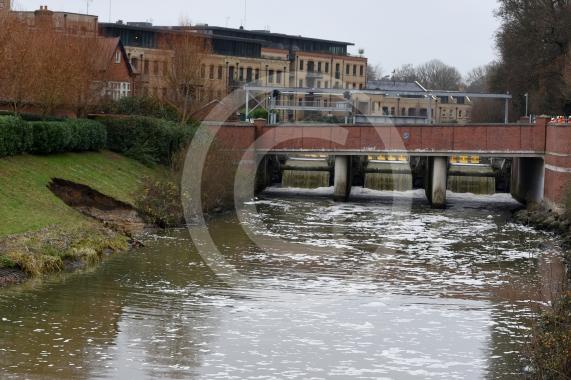 The Environment Agency is dropping 100 tonnes of rocks from a helicopter onto the embankments of the Jubilee River, Maidenhead. The channel has suffered from erosion due to recent storms and the rocks are planned to fix this.