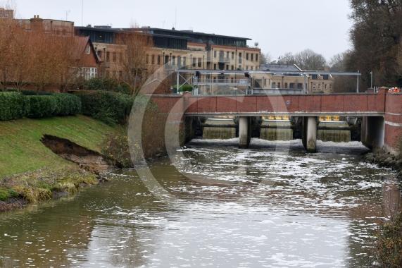 The Environment Agency is dropping 100 tonnes of rocks from a helicopter onto the embankments of the Jubilee River, Maidenhead. The channel has suffered from erosion due to recent storms and the rocks are planned to fix this.