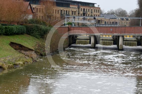 The Environment Agency is dropping 100 tonnes of rocks from a helicopter onto the embankments of the Jubilee River, Maidenhead. The channel has suffered from erosion due to recent storms and the rocks are planned to fix this.