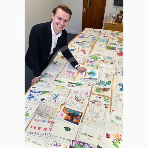 In the officeMP Josh Reynolds picking out his Christmas card winners