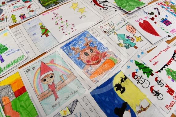 In the officeMP Josh Reynolds picking out his Christmas card winners