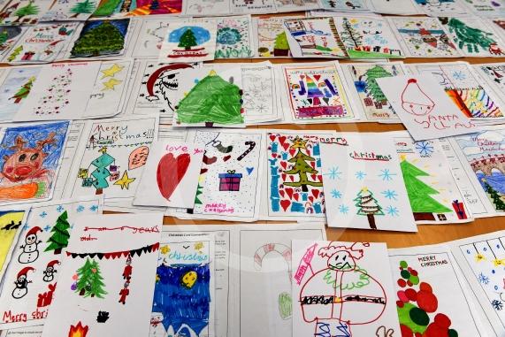 In the officeMP Josh Reynolds picking out his Christmas card winners