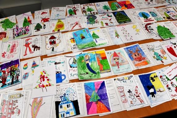 In the officeMP Josh Reynolds picking out his Christmas card winners