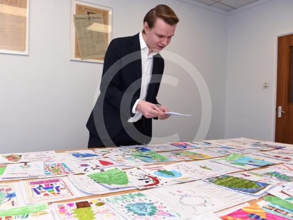 In the officeMP Josh Reynolds picking out his Christmas card winners