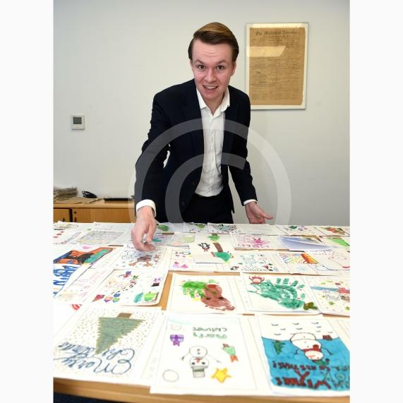 In the officeMP Josh Reynolds picking out his Christmas card winners