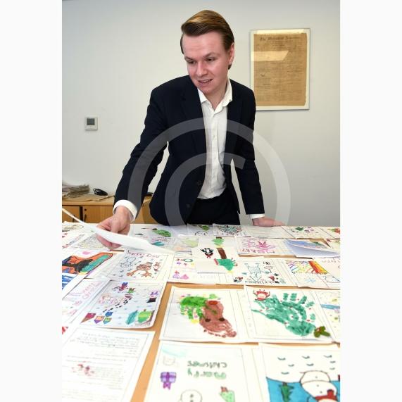 In the officeMP Josh Reynolds picking out his Christmas card winners