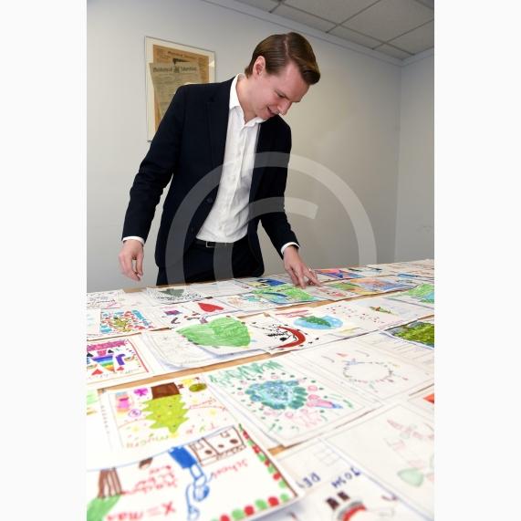 In the officeMP Josh Reynolds picking out his Christmas card winners