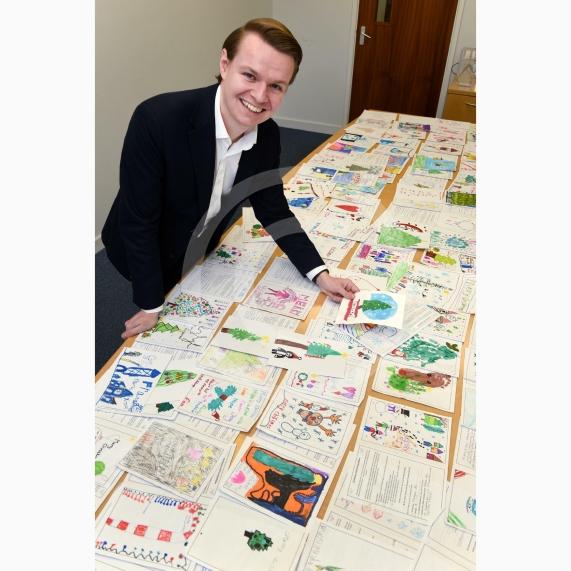 In the officeMP Josh Reynolds picking out his Christmas card winners