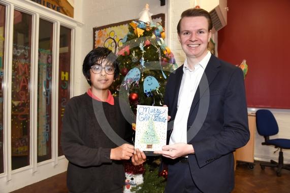 St Luke&rsquo;s Primary School, Cookham Road, MaidenheadJosh Reynolds with the Xmas card comp winner, Ayaan Shenoy 9