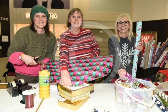 Thames Hospice fundraising group are carrying out Christmas wrapping in the Nicholsons Centre,MaidenheadL-R Susie Randall, Jenny Harris, Sue Stacey