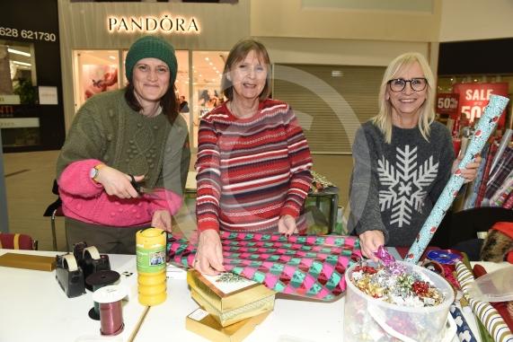 Thames Hospice fundraising group are carrying out Christmas wrapping in the Nicholsons Centre,MaidenheadL-R Susie Randall, Jenny Harris, Sue Stacey