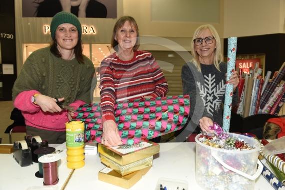 Thames Hospice fundraising group are carrying out Christmas wrapping in the Nicholsons Centre,MaidenheadL-R Susie Randall, Jenny Harris, Sue Stacey