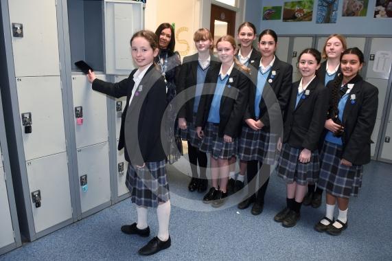 Headteacher Jo Capon and students outside Newlands Girls' School, Maidenhead The school is implementing a ban of smartphones on the school site from September. 