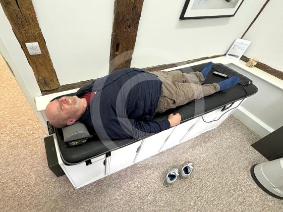 Back in Action. A company specialising in furniture that supports people with back problems has returned back to Cookham after years away. Photographer Ian Longthorne (testing out The Mobiliser - The Mobiliser bends and stretches the spine over a 15-minute session)Unit 2a, Lower Mount Farm, Cookham, Maidenhead 