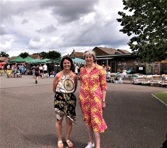 Headteacher Michelle Law shows Theresa May MP around The Colleton Primary School fete