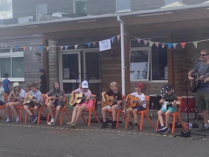 The school's guitar club celebrates The Colleton Primary School's 50th anniversary 